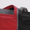 dutch design leather bag black bright red detail van de schouderband met ritssluiting en twee ritsva